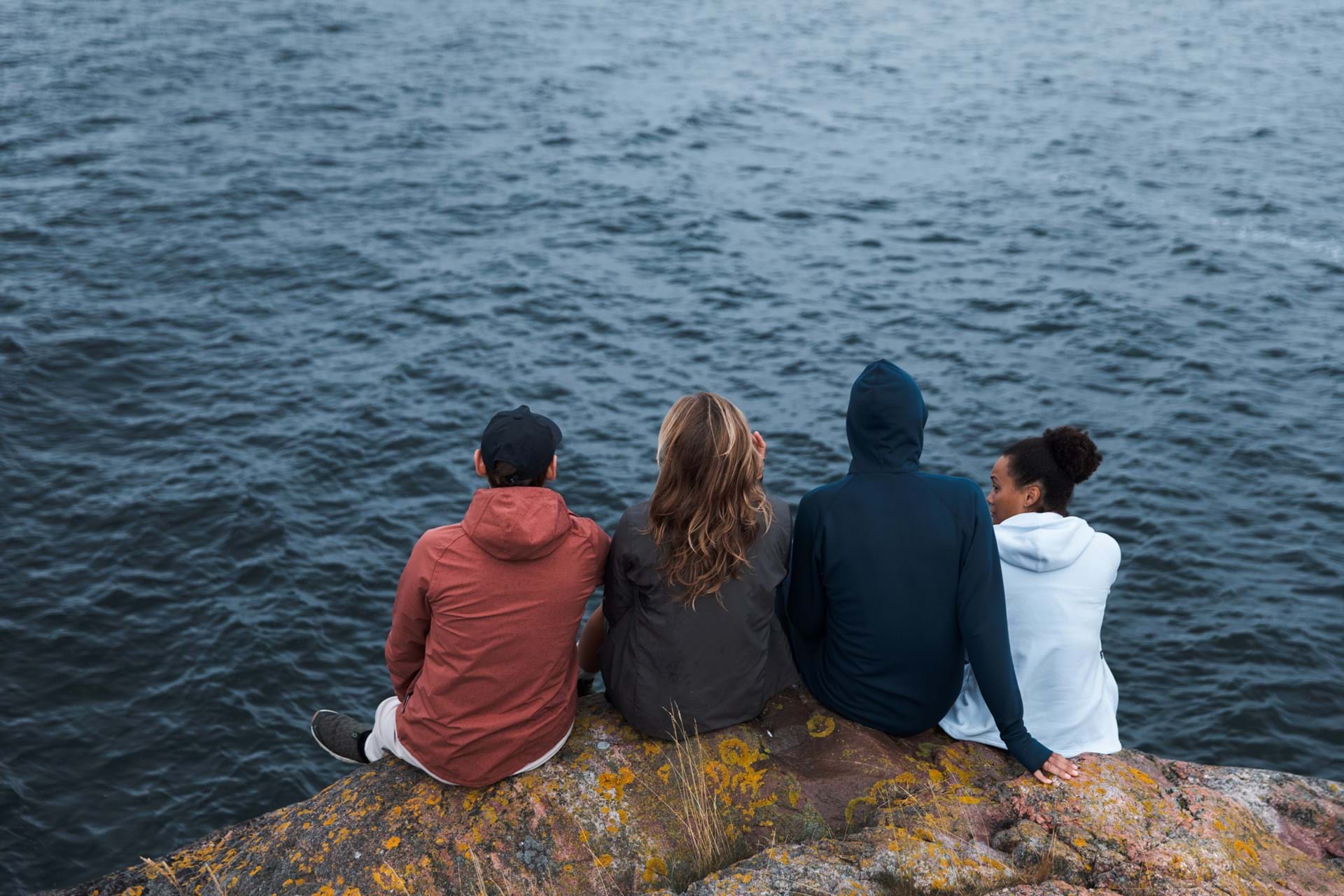 Four friends on a windy adventure staying warm in houdis and jackets from Houdini Sportswear